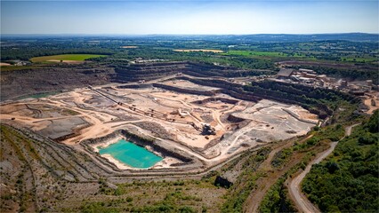 Aerial drone shot of a small open-pit coal mine in Colombia - obrazy, fototapety, plakaty