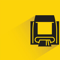 automated teller machine with shadow on yellow background