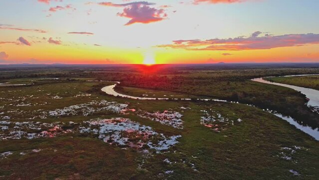 sunset on the Pantanal in Brazil flying over the flooded areas. Drone