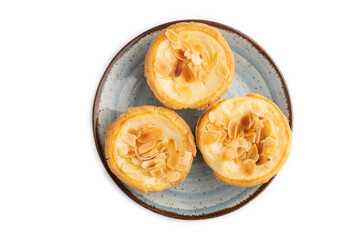 Traditional portuguese cakes pasteis de nata, custard small pies isolated on white. Top view.