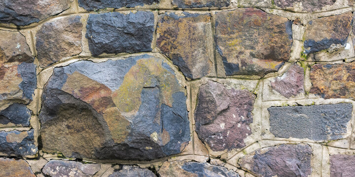 vintage stone masonry. boulders of a castle wall. ancient architectural background
