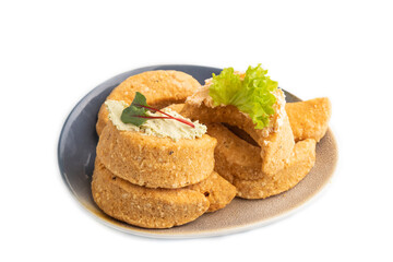 Homemade salted crescent-shaped cheese cookies isolated on white. top view.