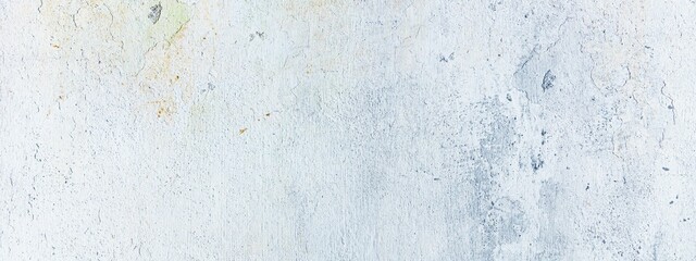 Closeup panoramic shot of the texture of dirty old plaster on the wall in white colors