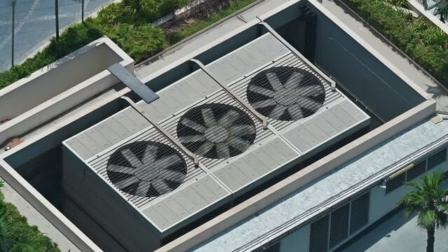 Industrial Air conditioner outdoor units with rotating ventilation fans for cooling radiators. United Arab Emirates