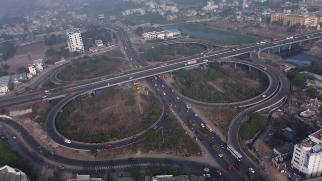 Iconic cloverleaf interchange of Maduravoyal flyover Bridge with smooth flowing traffic, Chennai, India
