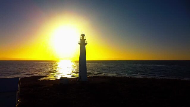 Drone footage of the historical lighthouse of Point Lowly at sunrise in South Australia