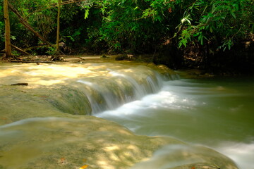 Waterfall flowing in the forest during the rainy season Namtok Wang Kan Lueang, Lop Buri - obrazy, fototapety, plakaty