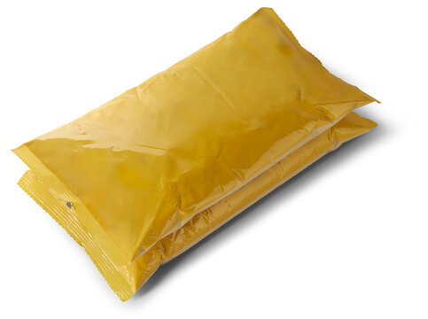 Pile Of Empty Or Blank Yellow Plastic Bag Product, Mock-up Template Packaging For Bulk Products Or Food, Milk Powder, Taken From Above For Graphic Designing, Isolated Background