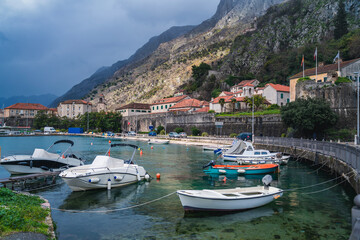 Fototapeta na wymiar Kotor old city, travel to Montenegro and the Balkans. View of the city and the bay with boats