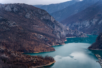 Beautiful mountain landscape, lake with blue water in the gorge in spring. Canyon Piva Pluzhine, travel to Montenegro