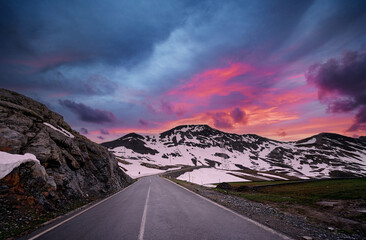 Fototapeta na wymiar Asphalt road in Alps mountains. Road trip concept. Beautiful landscape.