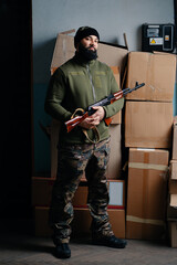 Urban Portrait of the armed bearded man