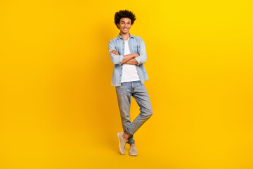 Fototapeta na wymiar Full length photo of positive successful person crossed arms posing isolated on yellow color background