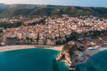 Tropea coastline and castle, aerial view during sunrise - obrazy, fototapety, plakaty