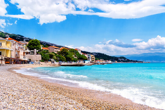 Baska on the island of Krk. Beautiful romantic summer scenery on the Adriatic Sea. Large beach in the harbor with crystal clear blue water. Croatia. Europe.