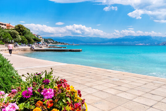 Baska on the island of Krk. Beautiful romantic summer scenery on the Adriatic Sea. Large beach in the harbor with crystal clear blue water. Croatia. Europe.