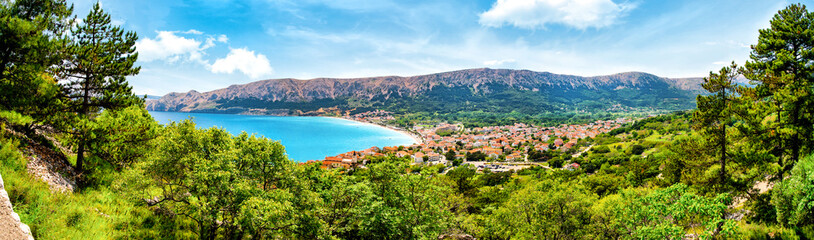 Fototapeta na wymiar Panorama view over the natur, coast and the town of Baska on the island of Krk. Beautiful romantic summer scenery on the Adriatic Sea. Croatia. Europe.