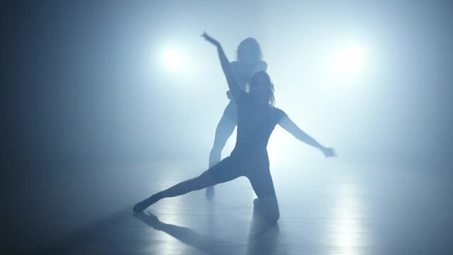 Seductive Strides: Dual Dance Performance Reveals Allure, Grace, and Unyielding Confidence. High quality 4k footage