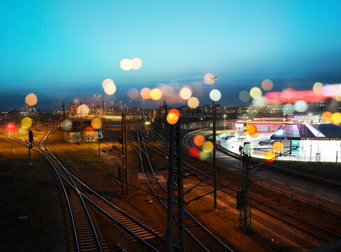 Railway And Gas Patrol Station In The Traffic And Cargo Night Of The City. 