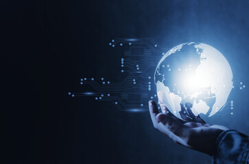 human hand holding virtual world globe and glow circuit board in blue color tone, networking technology digital communication concept