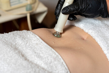 aesthetic treatment on the body of a woman in aesthetic center radio frequency and high frequency technique for health and beauty