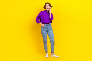 Fototapeta na wymiar Full length photo of cheerful person chatting communicate telephone isolated on yellow color background