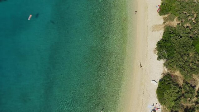 Aerial view of pebble Duba beach in Makarska riviera, the Adriatic Sea, Croatia