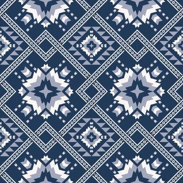 Blue color ethnic geometric pattern. Vector ethnic geometric square overlapping shape seamless pattern. Blue color ethnic pattern use for fabric, textile, wallpaper, cushion, upholstery, wrapping.