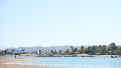 Serenity Unveiled: A Mesmerizing Sunset at Sea with Graceful Boats Amidst the Golden Hues, an Enchanting Moment of Tranquility and Nautical Beauty in Hurghada , El gouna , Egypt 