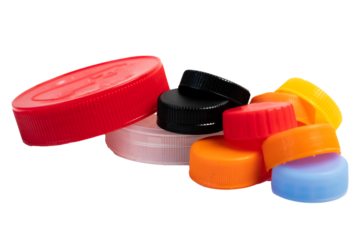 A pile of plastic bottle caps and jars isolated on white. Recyclable trash