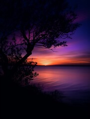 Fototapeta na wymiar Purple Sunset over the Lake Generative AI