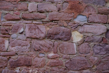 part of an ancient building, monastery, beautiful grey vintage texture of the wall of a medieval castle built in middle of 14th century, volumetric stones for the designer, wallpaper, empty background