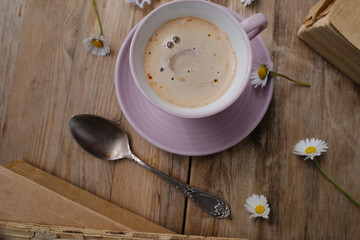 cup with drink coffee cappuccino with foam on old vintage wooden table top view, concept caffeine...