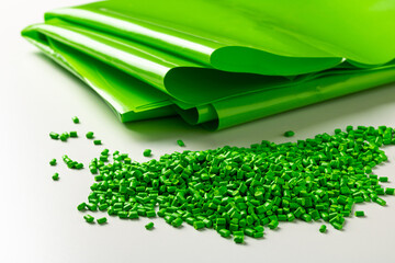 Green plastic granules near the polymer film