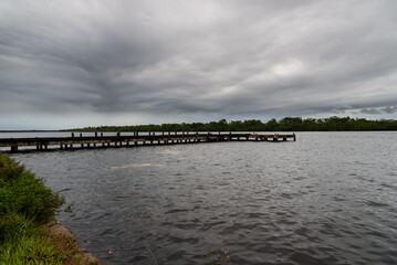 Obraz premium Old and abandoned wharf pier on the Rio das Almas in the city of Taperoa, Bahia.