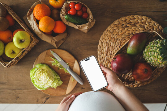 Phone with pregnancy nutrition app, space for your text - Powered by Adobe