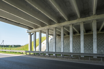concrete columns like pillars of an automobile bridge
