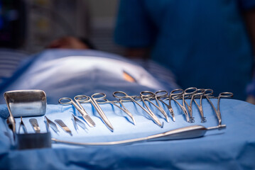Hand of Team surgery doctor in Operating Room hold operating scissor give to Surgeons During...