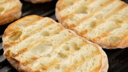 Fresh ciabatta bread on grill. Ciabatta bread holes