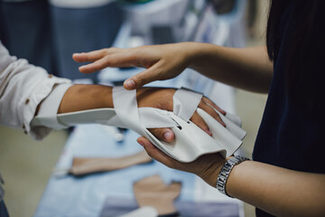 Therapist making asissistive device for immobilize patient hand. Splint service for hand injury...