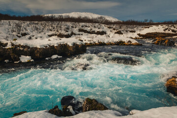 Bruarfoss waterfall and its surroundings captured on a winter afternoon in Iceland.