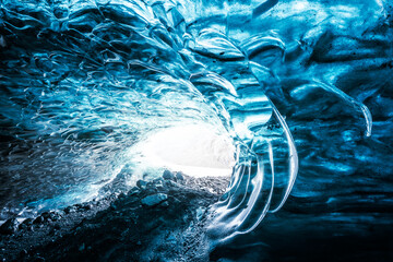 Ice Cave in Vatnajokull Glacier in Iceland - amazing colors create an unearthly atmosphere.
