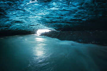 Ice Cave in Vatnajokull Glacier in Iceland - amazing colors create an unearthly atmosphere.