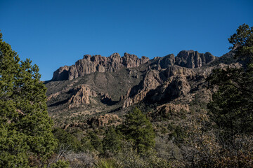 Looking Up at Chisos Mountains Against Blue Sky