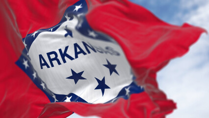 Arkansas state flag waving in the wind on a clear day