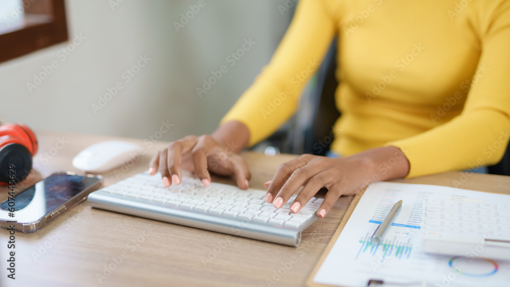 Poster close-up of hand of businesswoman working using laptop computer to record and print information for 