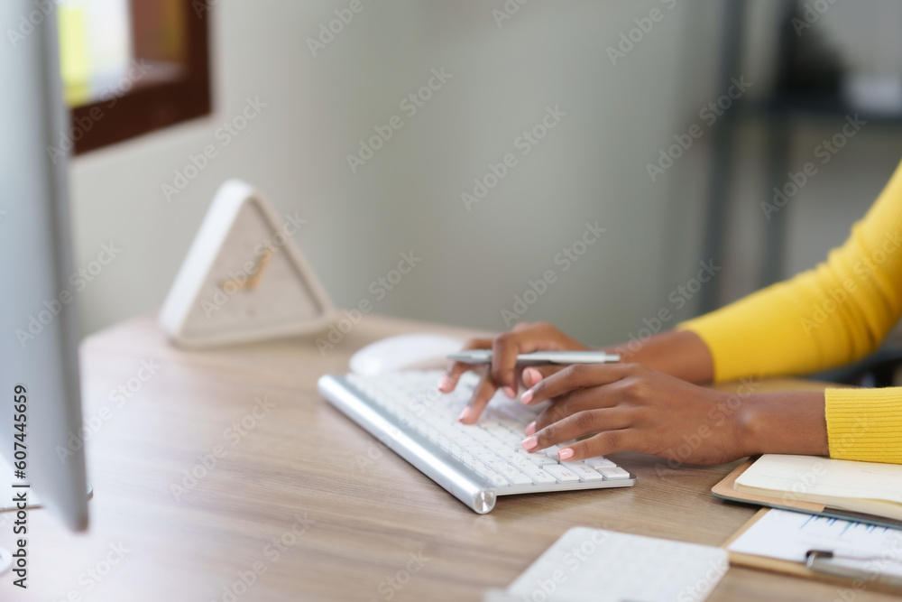 Poster close-up of hand of businesswoman working using laptop computer to record and print information for 