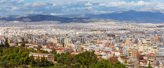 Skyline of Athens city, landscape with ruins of Temple of Hephaestus as seen from Areopagus hill....