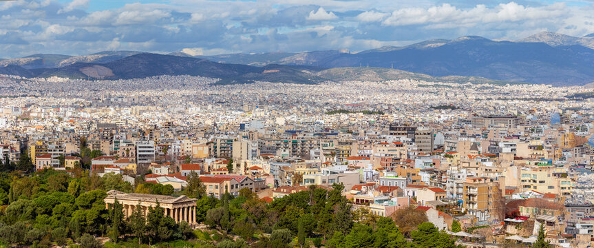 Skyline of Athens city, landscape with ruins of Temple of Hephaestus as seen from Areopagus hill. Scenic panoramic view of remains of ancient Athens, capital of Greece