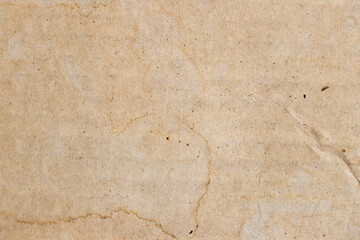 Water stained on brown corrugated packaging material background. Use as texture or layer decoaration